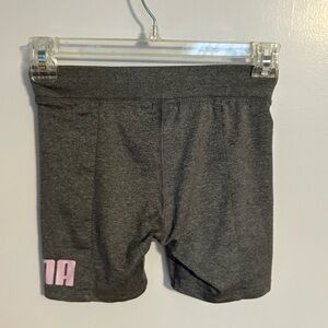 Puma women’s athletic shorts. Med size 8-10. Grey with pink logo